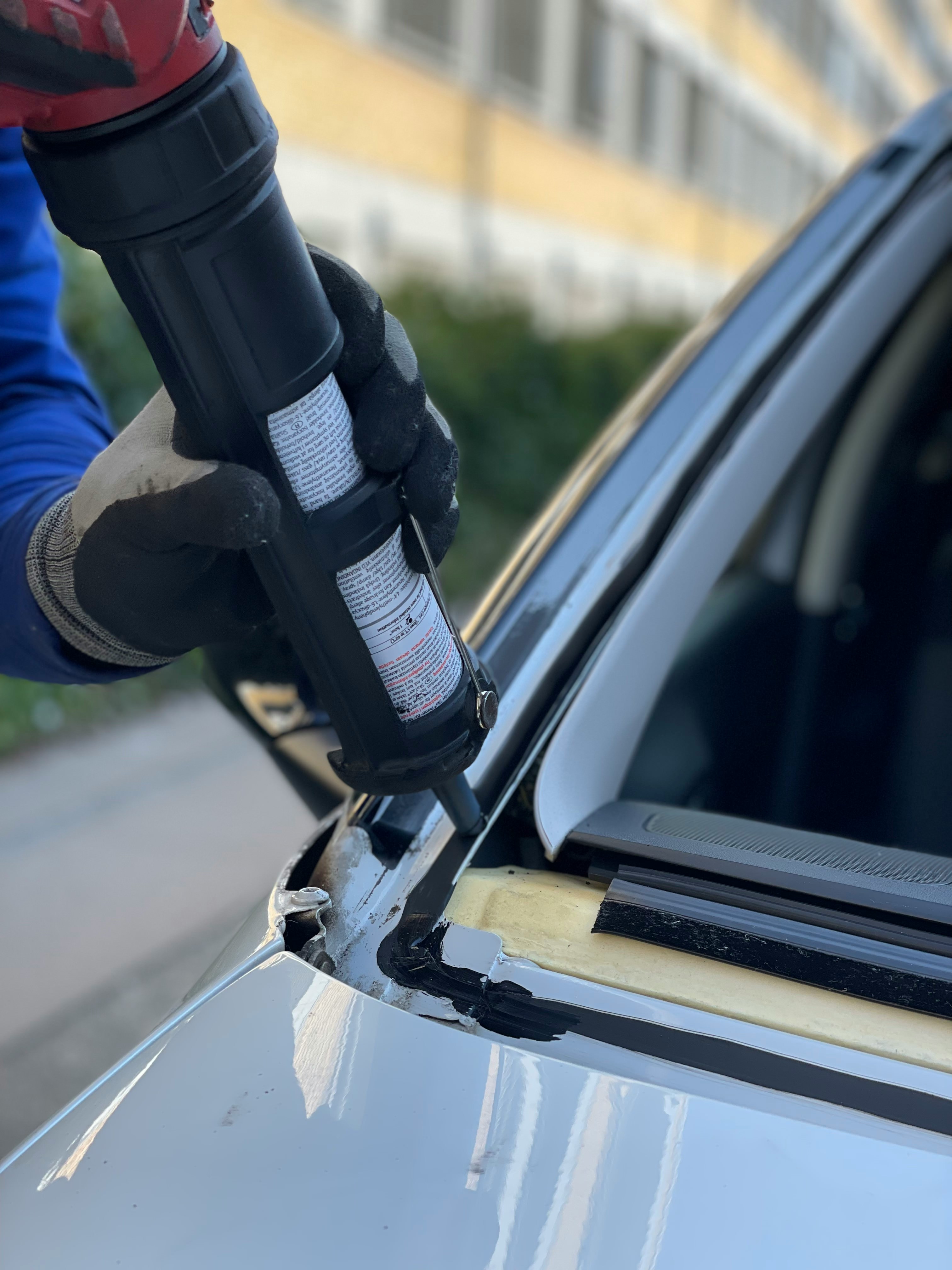 Auto glass technician working on a work truck windshield in Pasco, WA