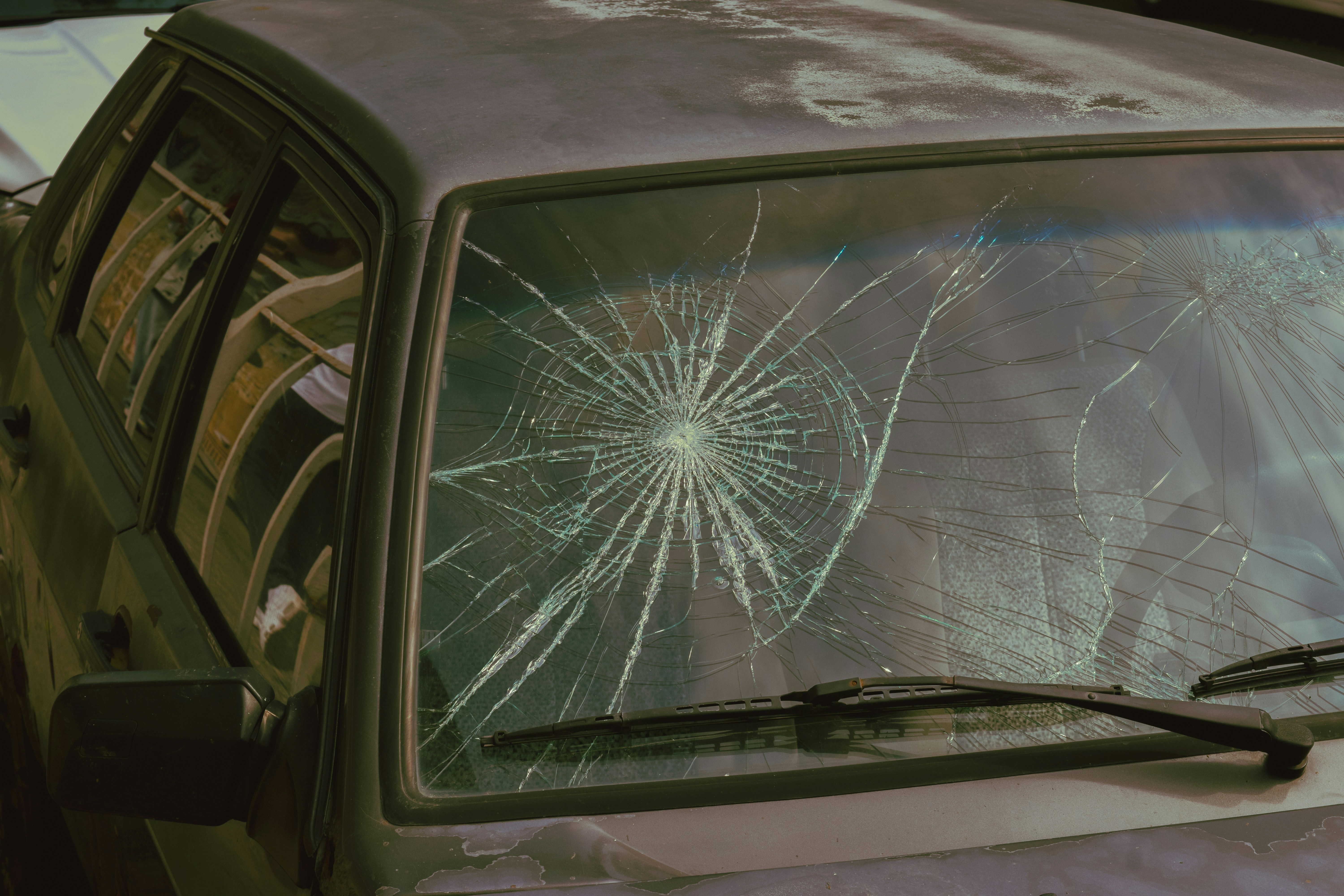Close-up of rock chip damage on a windshield from the Richland Bypass Highway
